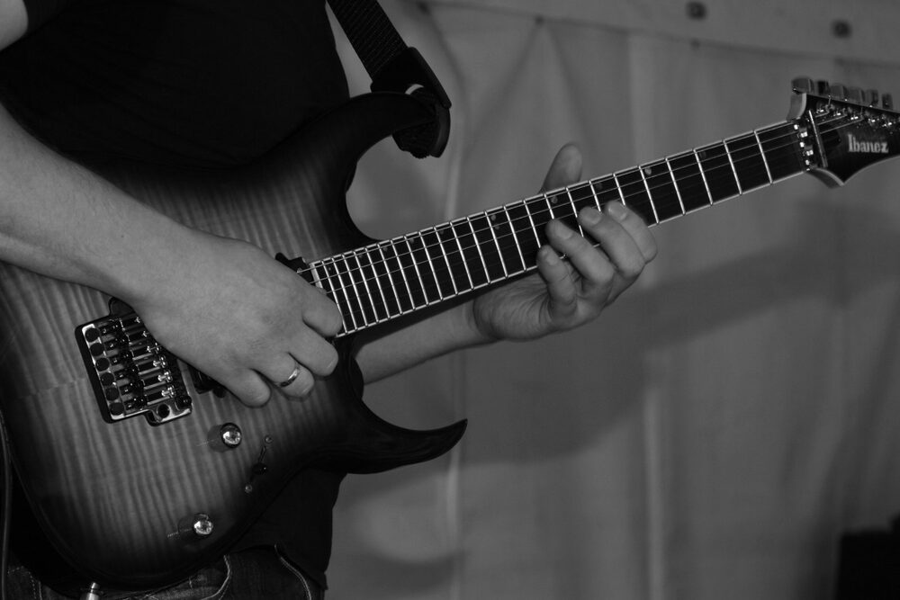Hands on an electric guitar