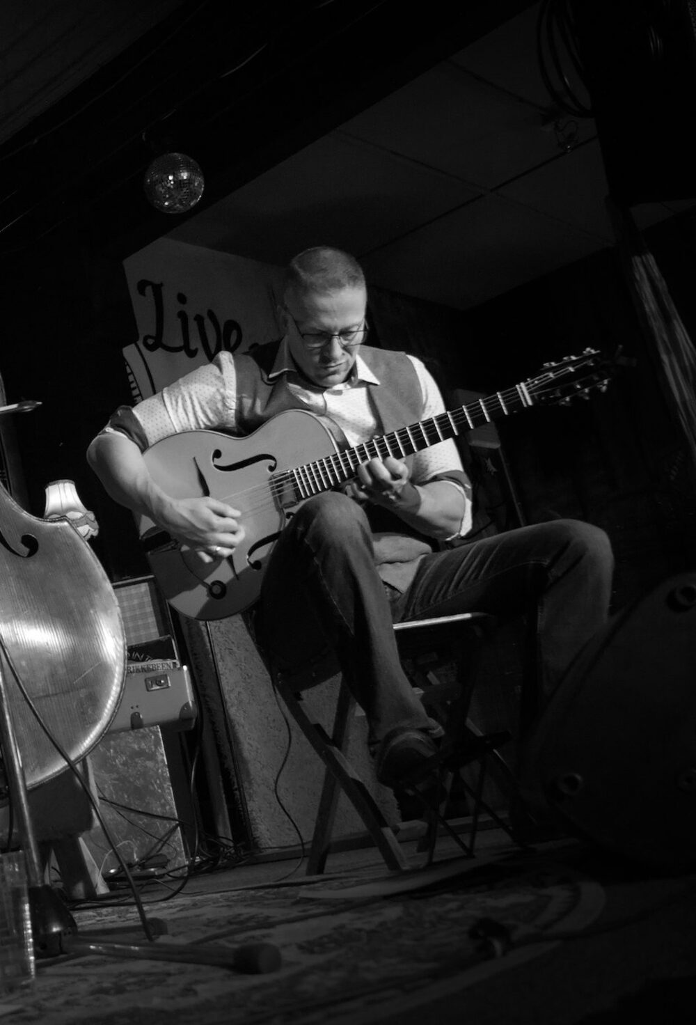 Alexander Stakenburg playing gypsy jazz guitar on stage